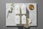 Balmain Paris complete bath amenity collection 1-gallon bulk refills on marble — wholesale luxury hotel toiletries for STR properties, villas, and high-end vacation rentals"