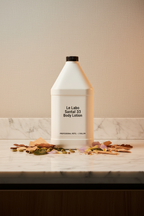 Le Labo Santal 33 1-gallon body lotion professional refill bottle on marble vanity — luxury hotel amenity supply for Fairmont, Park Hyatt, Airbnb STR, superyacht and private aviation