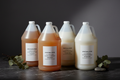 Jonathan Adler x JDV by Hyatt complete bulk amenity refill set — 4 x 1-gallon shampoo, conditioner, shower gel, and body lotion for luxury hotels, boutique STRs, superyachts, and hospitality operators